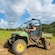 Guests driving a dune buggy on a dirt trail